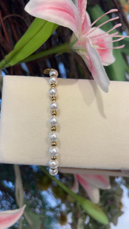 strech armband parel / goud